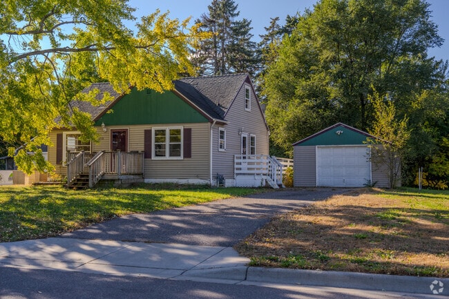 A ranch-style home in Grandview features a porch and detached garage.