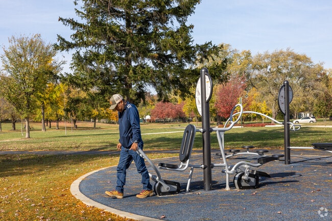 Work out at the outdoor fitness gym in Corrine J. Rose Park.