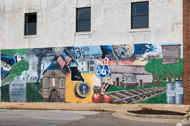a community mural honors Marshfield residents with portraits and names.