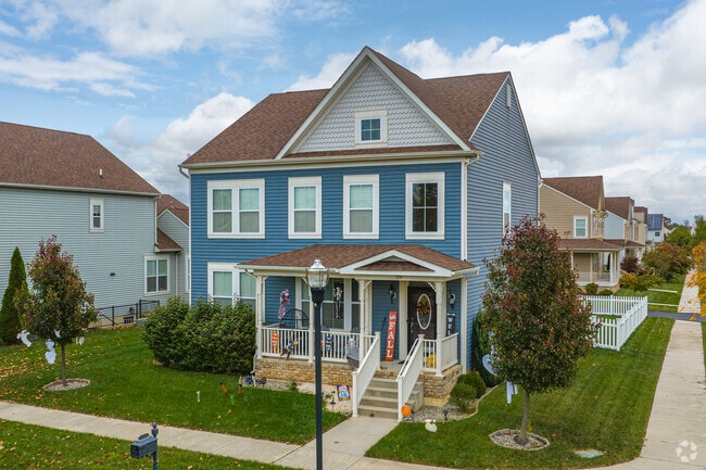 New Colonial homes in Odessa combine colorful exteriors with inviting front porches.