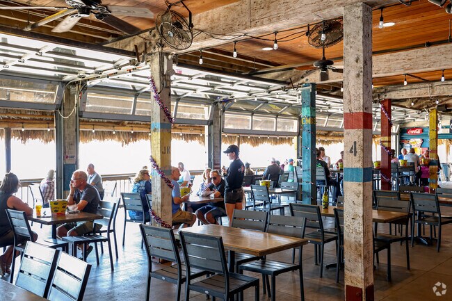 Eaton's Beach Sandbar & Grills outdoor seating provides the best beachfront views.