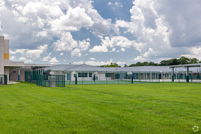 Pinecrest Elementary School in Immokalee features multiple outdoor recreation areas.