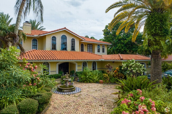 A Boca West villa-style home will often feature a front fountain and brick driveways.