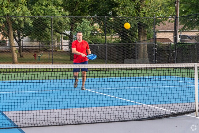 Lions Park features many amenities including a playground and pickleball courts.