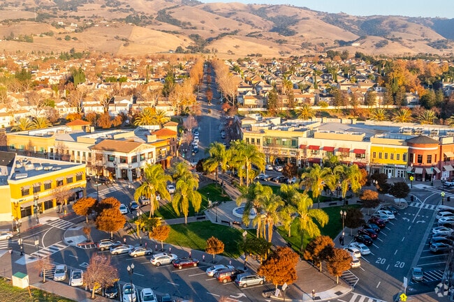 Homes here offer generous spaces and proximity to nature and city life.