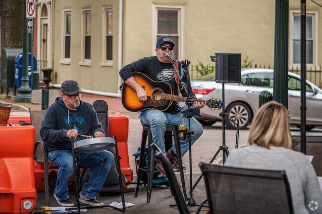 Residents catch live music at the Gay Street Open-Air Market near East Bradford.