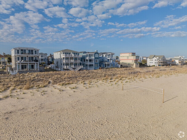 Locals love to play volleyball with their families on the sand near Chic's Beach.