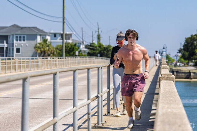 For some good energy, Eric from Carolina Heights opts for the sidewalk leading out to Wrightsville Beach.
