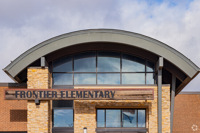 Close up shot of the arch roof and text signage of Frontier Elementary.