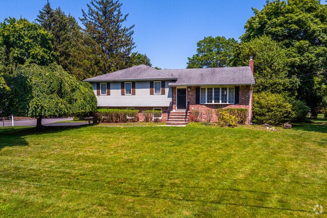 Split-level homes in Hillsdale often come with large front lawns.