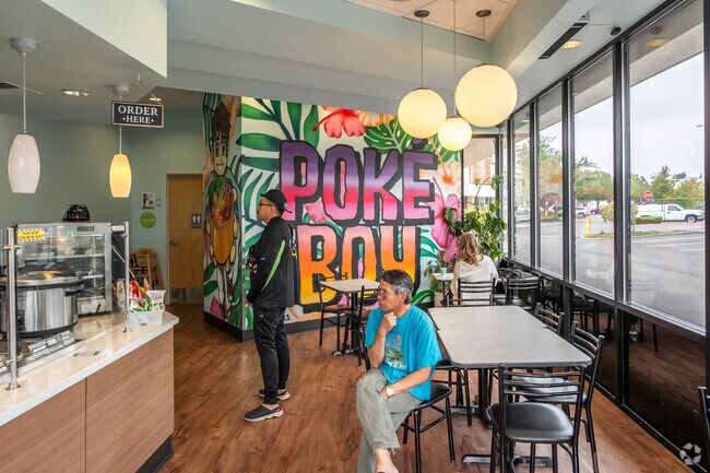 Poké Boy has a vibrant mural and laid-back atmosphere in Cascade View.
