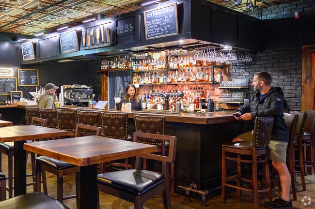 Guests enjoy a glass of bourbon at 1631 Burgers Bourbon & Brew in Poquoson West.