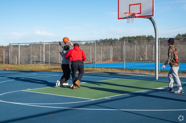 A Middleborough Center resident splits the double team and cuts to the hoop at Pierce Park.