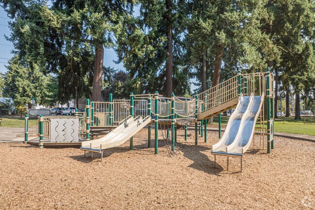 Children enjoy the updated playground at Evergreen Park in Fourth Plain Village.