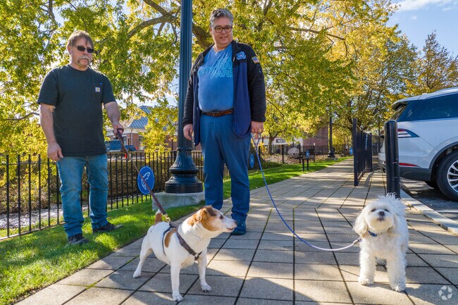 Hawthorne locals stroll with their dogs along West Broadway Avenue, adding to the neighborhood’s welcoming vibe.