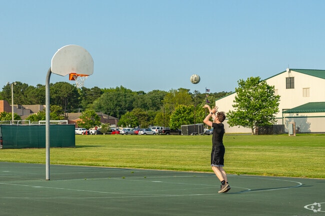 Practice your jump shot on the basketball court at John Walter Smith Memorial Park.
