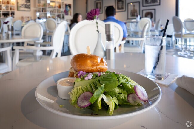 El Mirador residents can indulge in a delicious burger at Eight4Nine Restaurant.