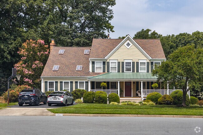 Beautiful modified colonial home equipped with a wrap around porch in Glenmont.