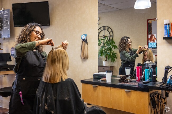 A customer chats with their stylist at the superbly named Curl Up & Dye in Middlesex, NJ.