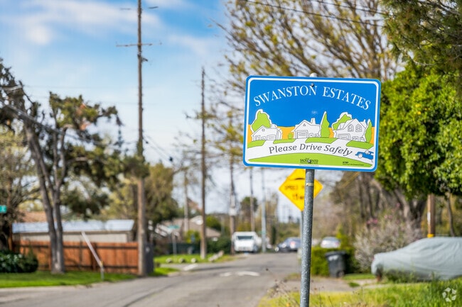 A sign welcomes you to the neighborhood of Swanston Estates.