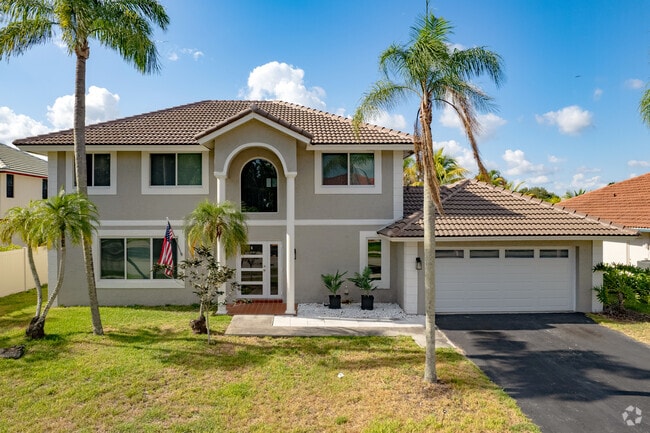 A gorgeous, modern two-story home shines bright in the Shenandoah neighborhood of Davie, FL.
