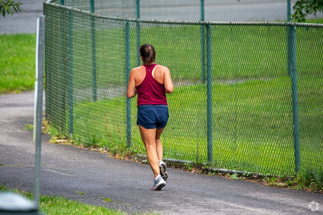 A Hawthorne resident runs down the bike path through Rock Creek Park.