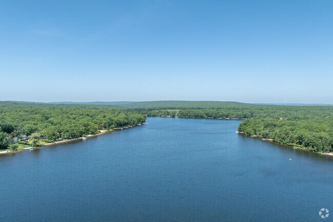 There are houses built all around Bear Foot Lake in Penn Forest.