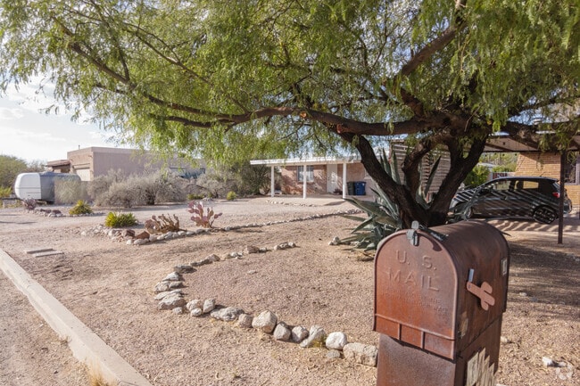 Find rustic details like aged mailboxes and stone circle landscaping in Swan Way Park.