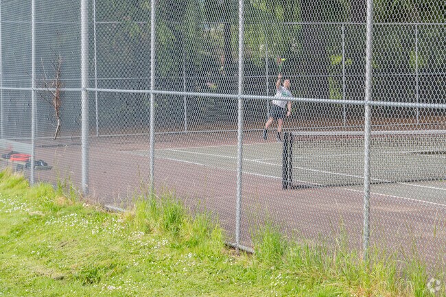 Locals enjoy the tennis courts at Mt. Tabor Park.