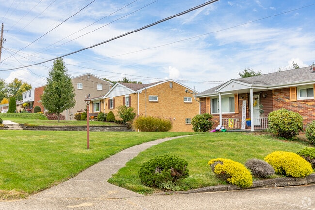 Homes' front yards in Greensburg are nicely manicured and spacious.
