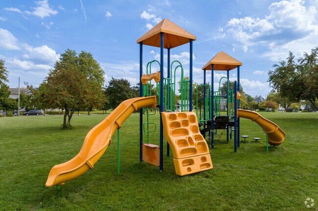 The playground at Golden Rule Park in Southside sits on pristine manicured lawn.
