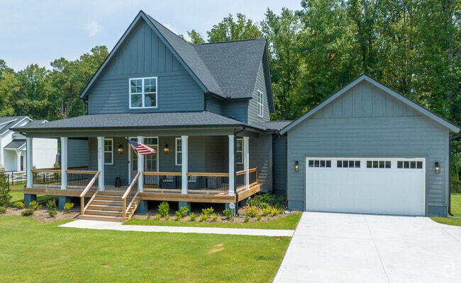 Some New Hill homes showcase spacious covered porches.