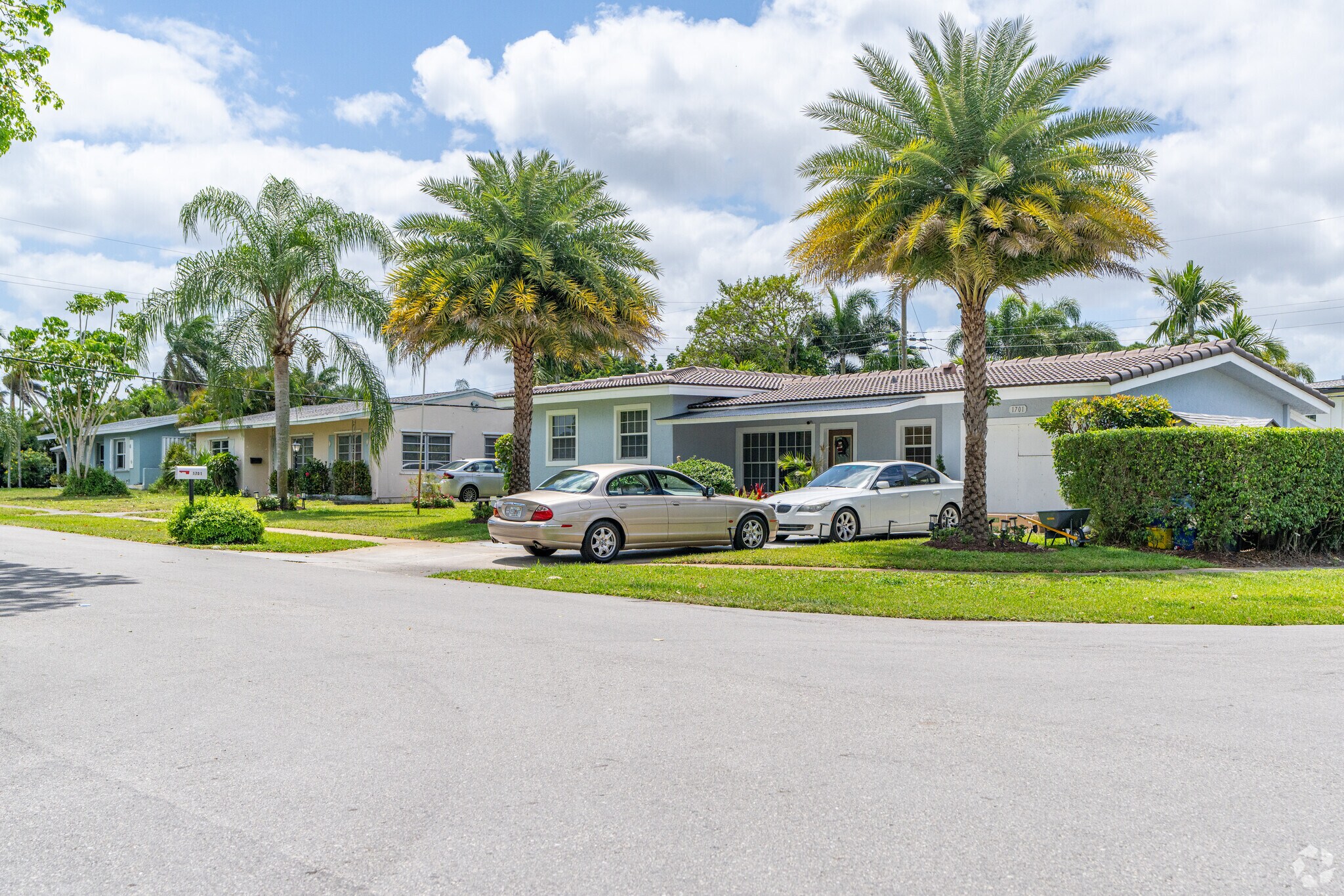Rows of elegant homes line the streets of Whispering Palms, exuding charm.