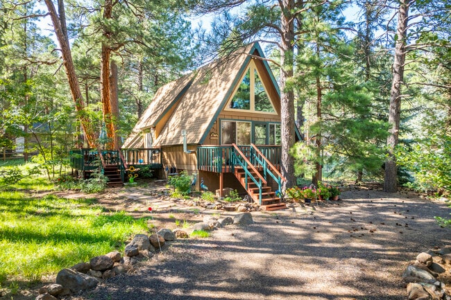 Live surrounded by nature in the charming cabin-style homes of Kachina Village.