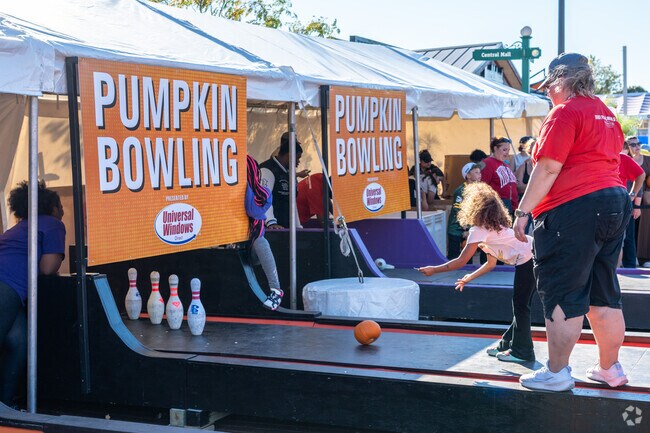 Try your hand at pumpkin bowling at Harvest Fair near Rainbow Gardens.