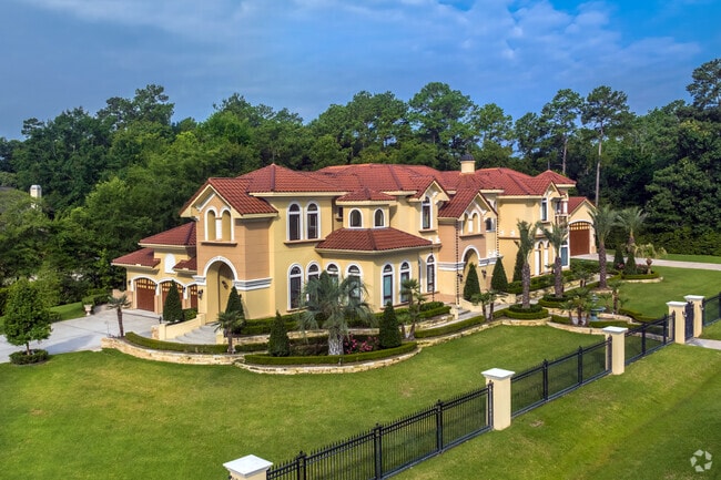 A two-story, Mediterranean-style Millennial mansion with a large guesthouse in Benders Landing.
