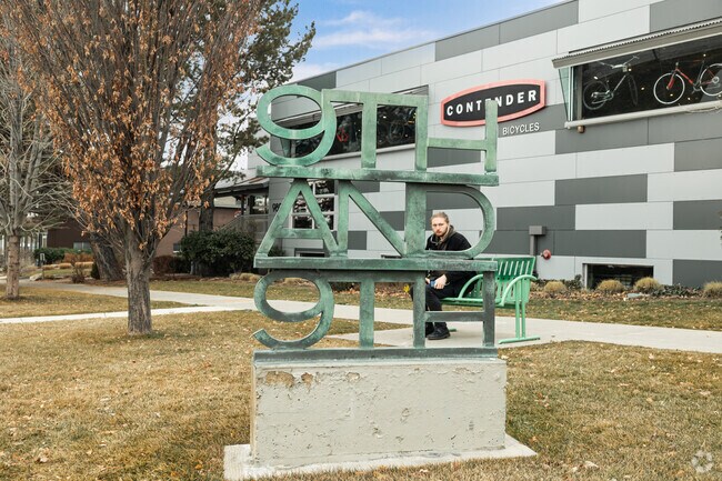 A man peers through a 9th and 9th sculpture in East Central.