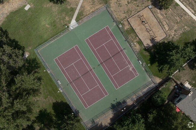 Green and burgundy tennis courts can be found at Harrisville Park.
