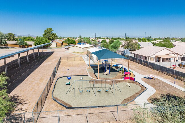 John R. Davis Elementary School has a fenced-in playground for a safe play area.