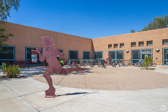 Metal artwork depicting a playful child at Rancho Santa Fe Elementary School in Avondale.