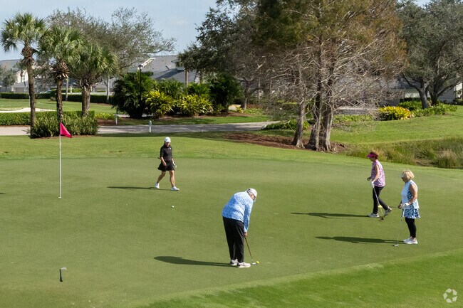 Golfers in Heritage Palms can play a round with friends on the club's private course.
