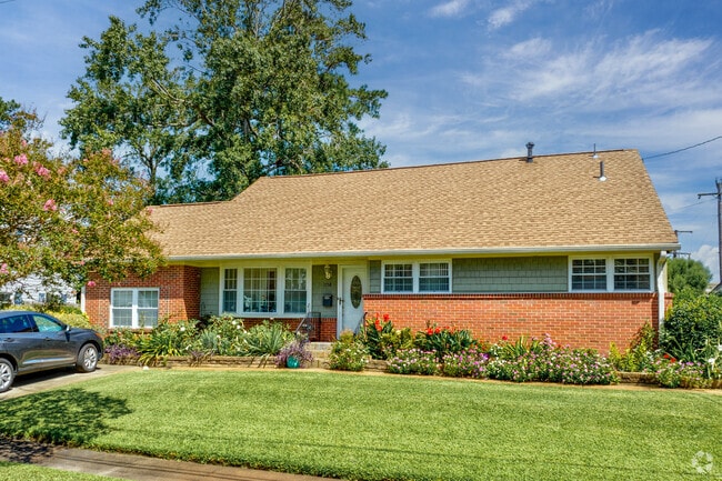 A well-kept garden adds charm to this home in Norfolk’s Larrymore Lawns neighborhood.