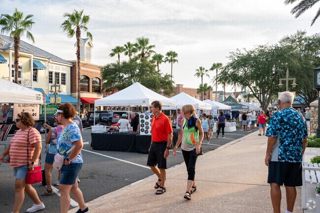 Village of Virginia Trace residents enjoy the busy town square in Lake Sumter Landing.