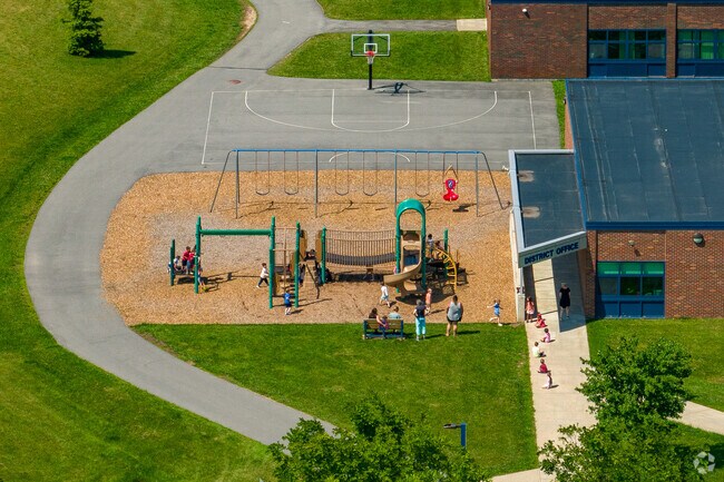 Solvay Elementary School has a small playground and basketball court for students to enjoy.