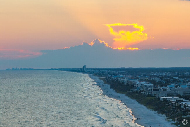 A gorgeous sunset can be seen from the beach in Paradise by the Sea.