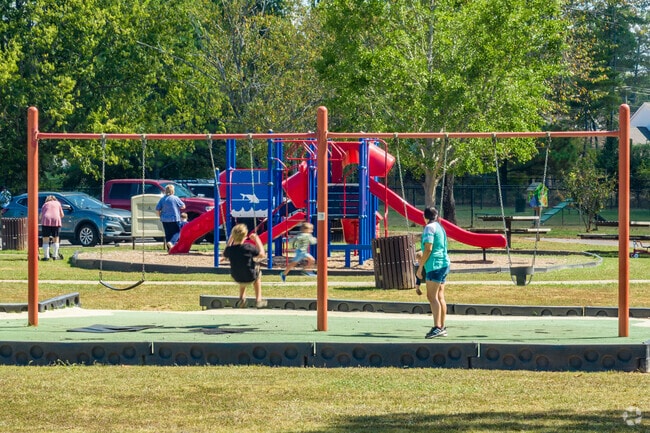 Children have swings and a playground to play on in Heritage Park.