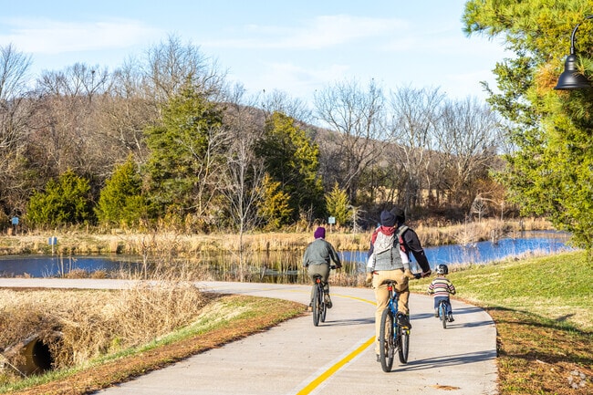 Take a bike ride with family and enjoy the serene views of Northwest Arkansas.