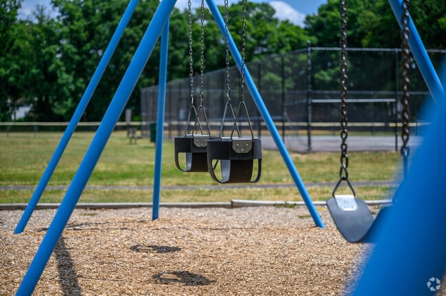 Kids can play on the swing set at Virginia Hills Playground.