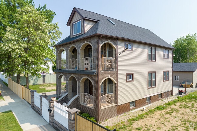 An American Foursquare bungalow home adds historic charm to this residential street in Clayton.