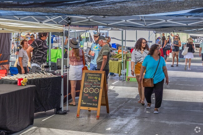 Several of the vendors share samples with Old Town Scottsdale Farmers Market goers.